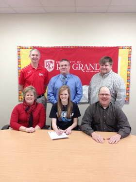 Gallia Academy's Morgan Foster poses with her parents, coaches and administrators after signing with Rio Grande